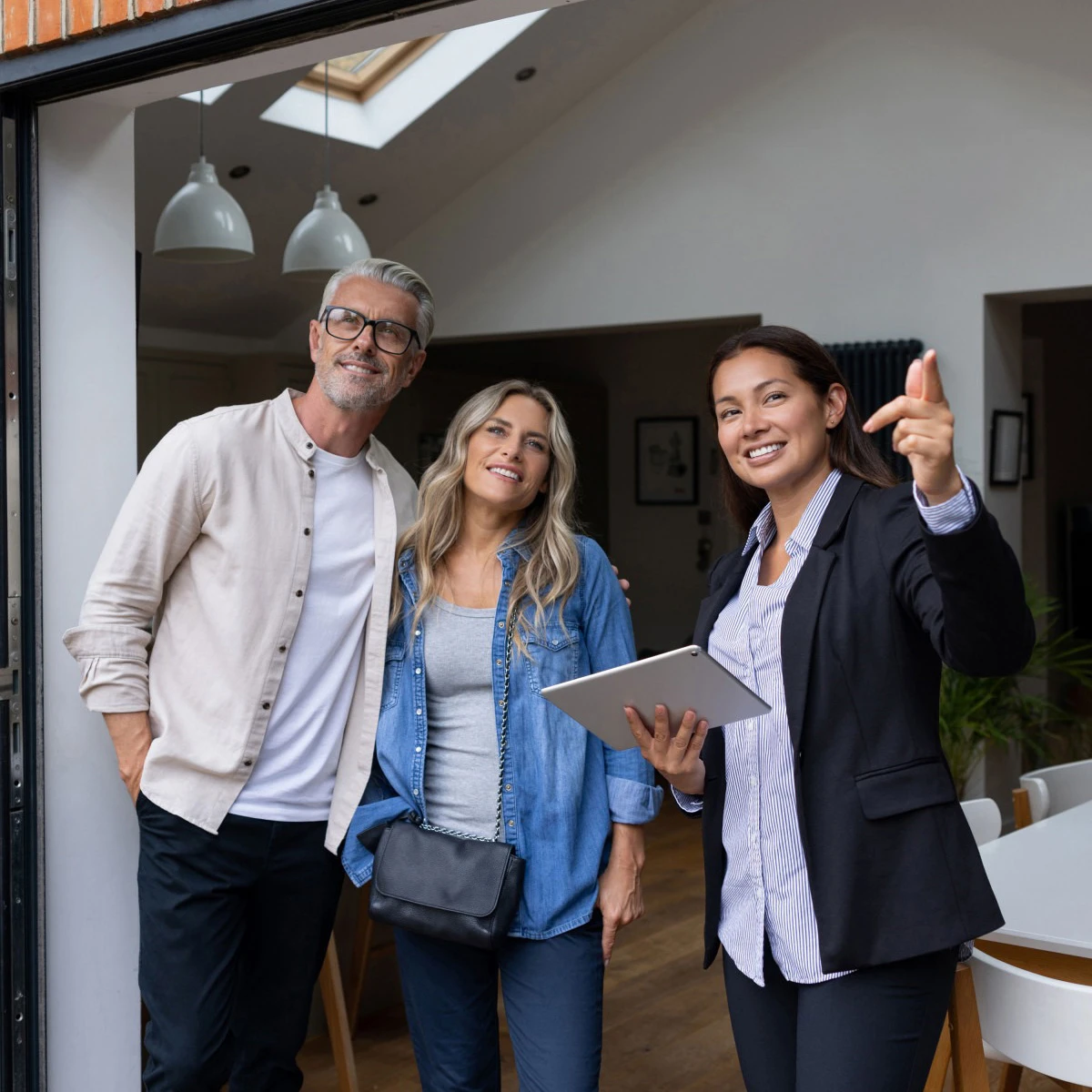 Vege Lend couple with mortgage adviser with ipad